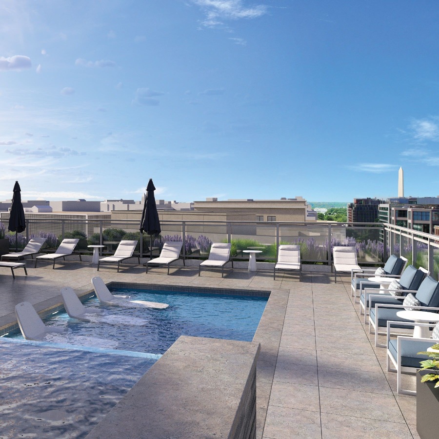a swimming pool with lounge chairs