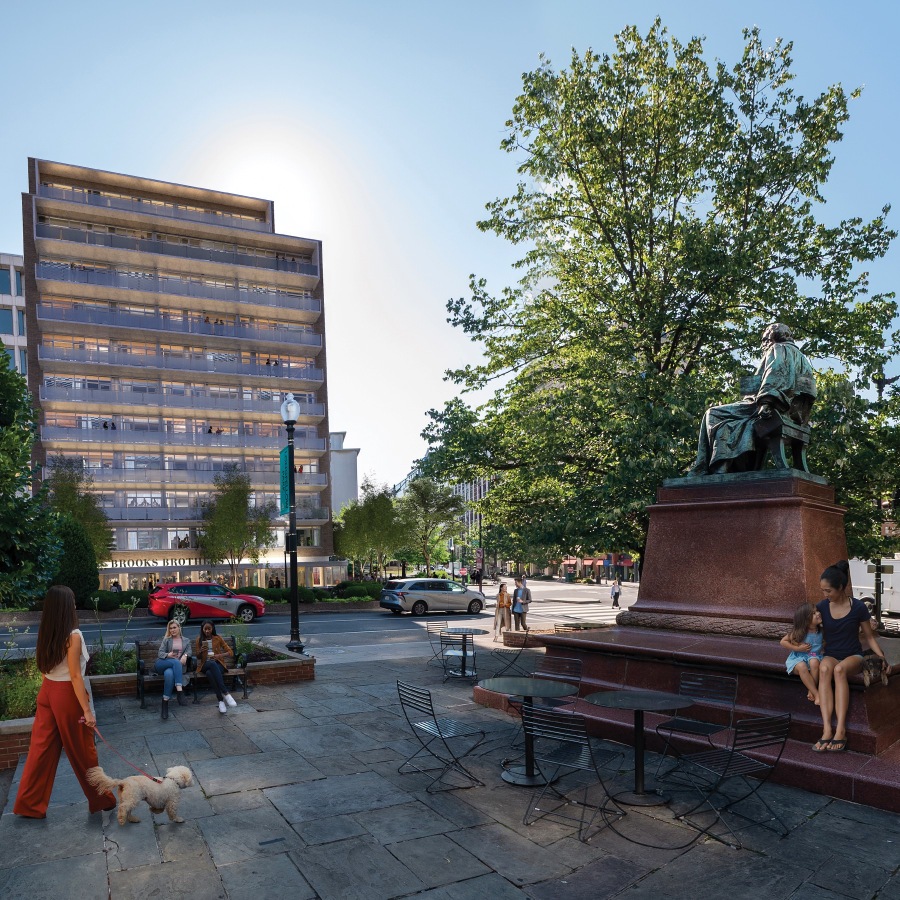 a park with people and a statue